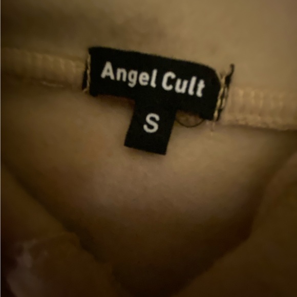 A new light brown, with a smooth cotton texture on the inside - Picture 3 of 4